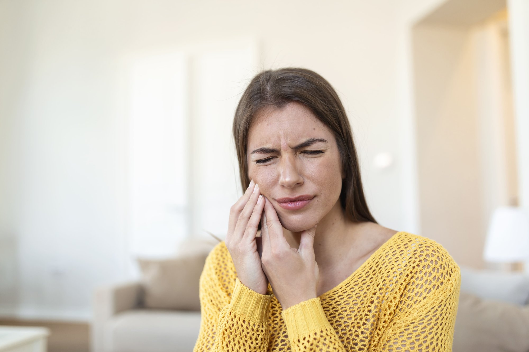 tooth-pain-dentistry-beautiful-young-woman-suffering-from-terrible-strong-teeth-pain-touching-cheek-with-hand-female-feeling-painful-toothache-dental-care-health-concept-high-resolution (1)